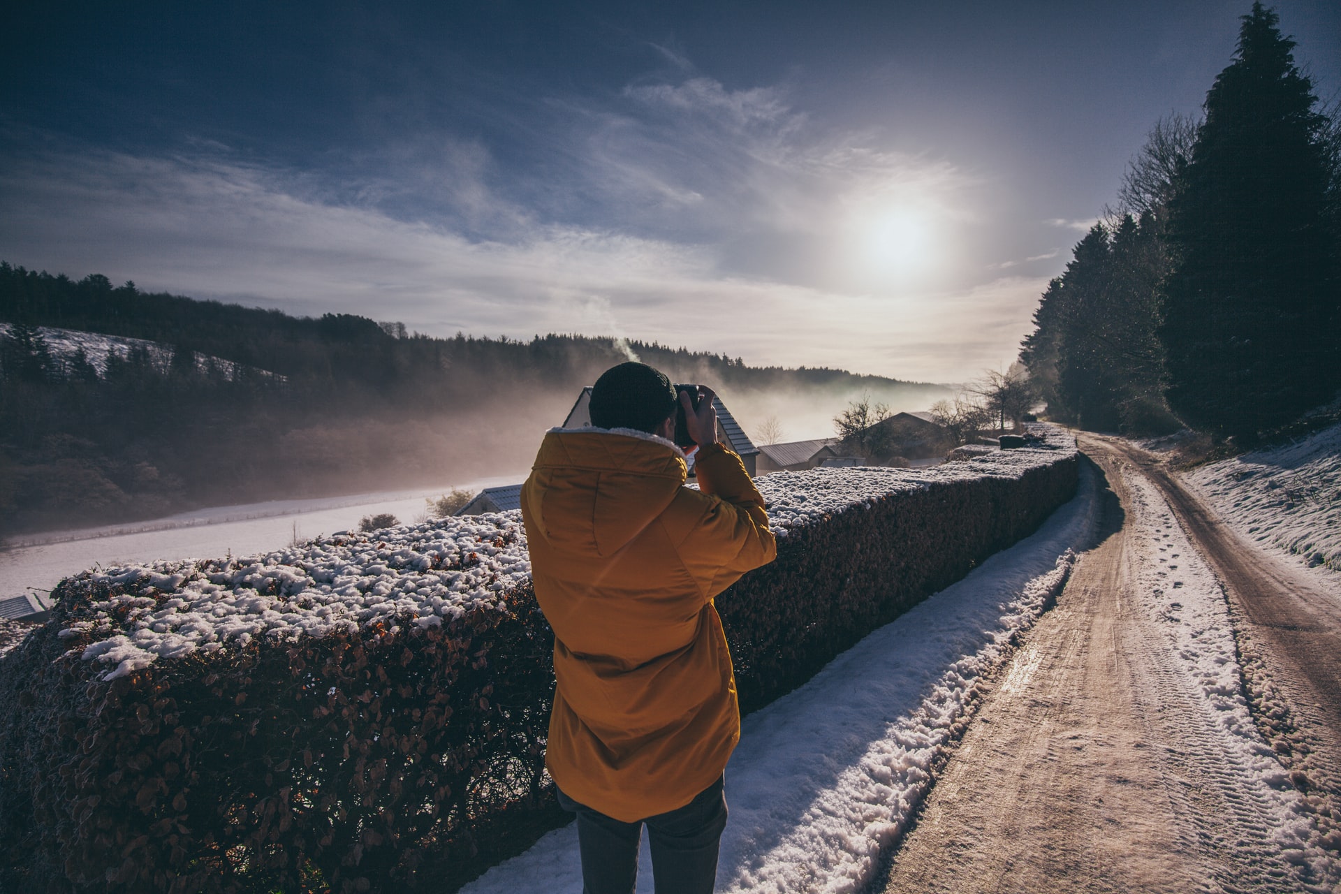 person taking picture during winter